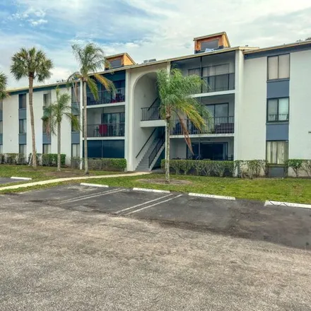 Buy this 2 bed condo on Green Pine Boulevard in West Palm Beach, FL 33049