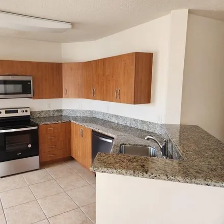 Rent this 3 bed condo on 135 Southwest Peacock Boulevard in Port Saint Lucie, FL 34986
