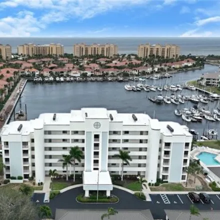 Buy this 2 bed condo on Cape Cole Boulevard in Burnt Store Marina, Lee County