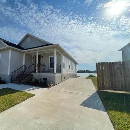 Rent this 3 bed house on 7230 Beauvoir Court in Lake Carmel, New Orleans