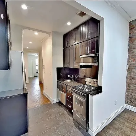 Rent this 4 bed apartment on 409 West 51st Street in New York, NY 10019