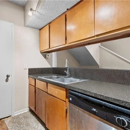 Rent this 4 bed condo on 1003 West 26th Street in Austin, TX 78705