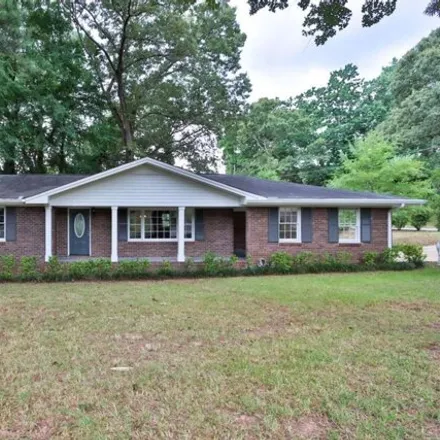 Buy this 3 bed house on 5555 Woodland Dr in Douglasville, Georgia