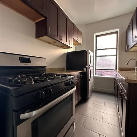 Rent this 4 bed apartment on 215 East 121st Street in New York, NY 10035