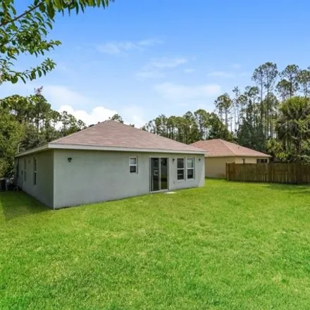 Rent this 4 bed house on 18 Poinsettia Ln in Palm Coast, Florida