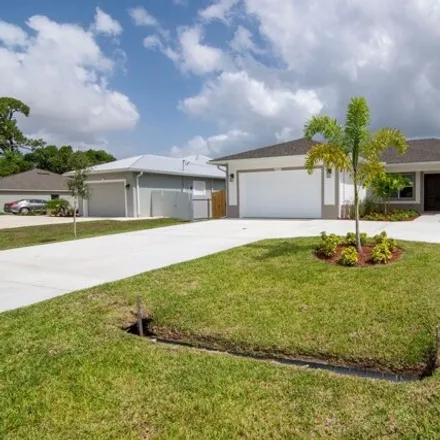 Buy this 4 bed house on 2221 Southwest Savage Boulevard in Port Saint Lucie, FL 34953