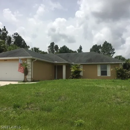 Rent this 4 bed house on 1236 Hillcrest Street in Lehigh Acres, FL 33974