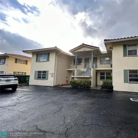 Rent this 2 bed condo on Woodside Drive in Coral Springs, FL 33067