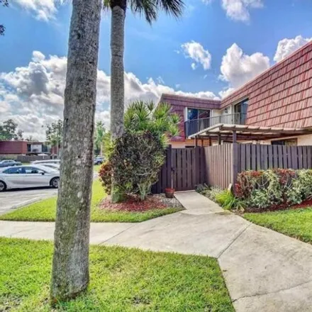 Buy this 3 bed townhouse on 8290 Boca Rio Drive in Sandalfoot Cove, Palm Beach County