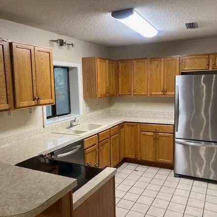 Rent this 3 bed apartment on 2154 Vine Court in Navarre, FL 32566