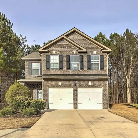 Buy this 4 bed house on 7699 Absinth Drive in Fulton County, GA 30349