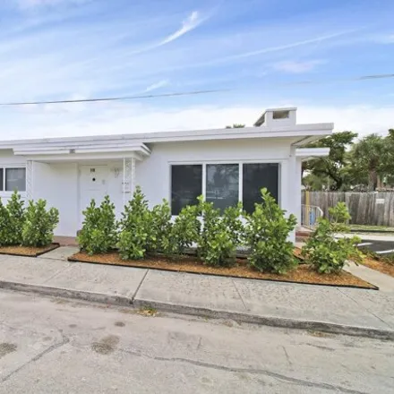 Rent this 3 bed house on 126 South C Street in Lake Worth Beach, FL 33460