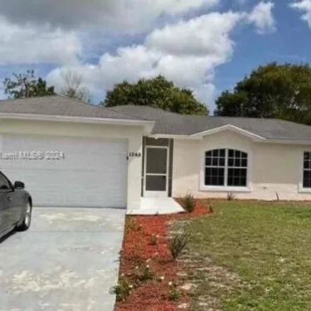 Rent this 3 bed house on 1247 Southwest Empire Street in Port Saint Lucie, FL 34983