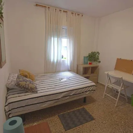 Rent this 4 bed room on Carrer del Mestre Valls in 46022 Valencia, Spain