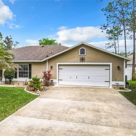 Buy this 4 bed house on 74 Laguna Forest Trail in Palm Coast, FL 32164