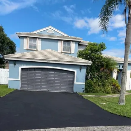 Buy this 4 bed house on 5599 Northwest 54th Lane in Coconut Creek, FL 33073