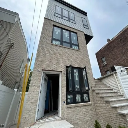 Buy this 8 bed house on 206 Fulton Avenue in Greenville, Jersey City