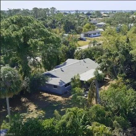 Buy this 3 bed house on 2041 Flamingo Drive in East Mobile Manor, North Fort Myers