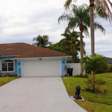 Buy this 3 bed house on 547 Southwest Hiawatha Street in Port Saint Lucie, FL 34953
