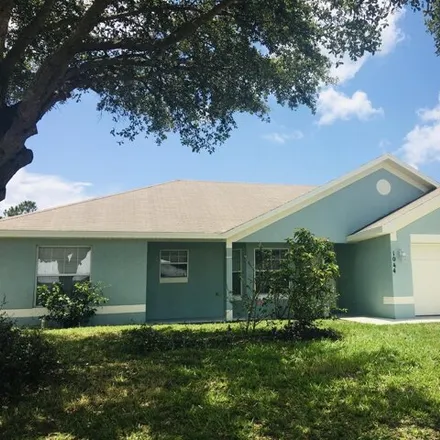 Rent this 3 bed house on 1028 Southwest Ingrassina Avenue in Port Saint Lucie, FL 34953