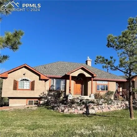 Buy this 4 bed house on 7308 Winding Oaks Drive in Colorado Springs, CO 80919