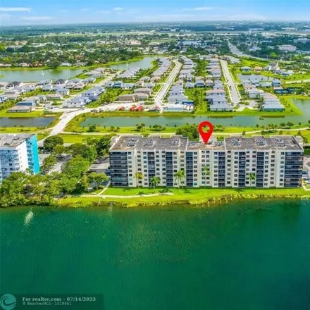 Buy this 2 bed condo on Lake Emerald Drive in Royal Palm Isles, Broward County