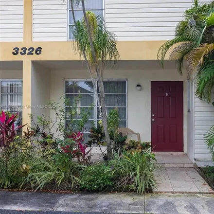 Rent this 4 bed townhouse on 3360 Farragut Street in Hollywood, FL 33021
