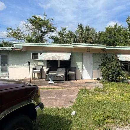 Buy this 3 bed house on 229 Northwest 27th Terrace in Broward County, FL 33311