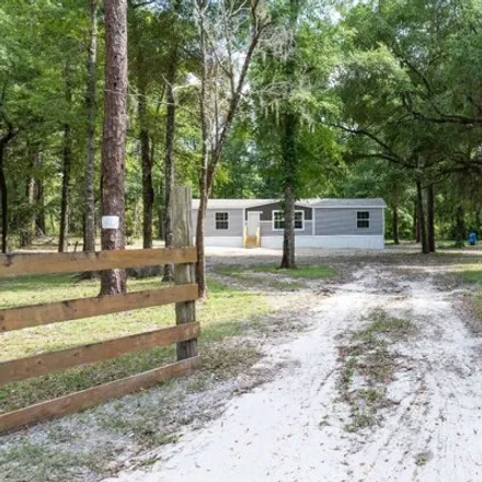 Buy this studio apartment on 264 Southwest Walnut Place in Columbia County, FL 32038