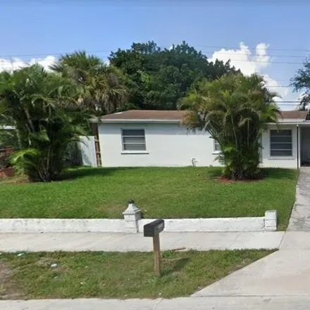 Rent this 4 bed house on 1117 Avenue T in Riviera Beach, FL 33404
