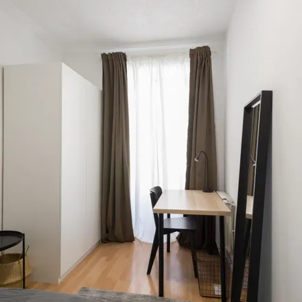 Rent this 11 bed room on Calle de Cedaceros in 8, 28014 Madrid