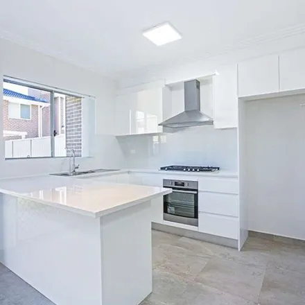 Rent this 3 bed apartment on Old Glenfield Road in Casula NSW 2170, Australia
