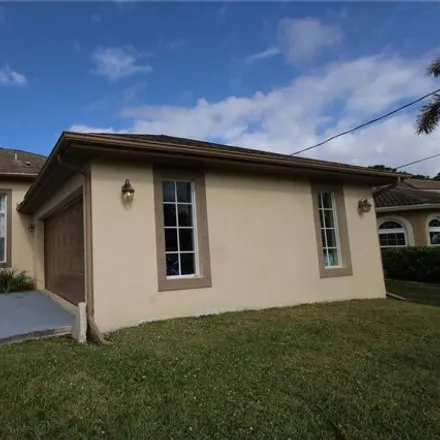Rent this 4 bed house on 5402 Northwest Clark Avenue in Port Saint Lucie, FL 34983