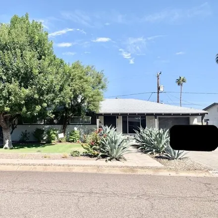 Rent this 4 bed house on 1308 West Hazelwood Street in Phoenix, AZ 85013