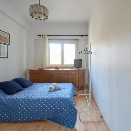 Rent this 3 bed room on Rua Luciano Freire in 1600-093 Lisbon, Portugal