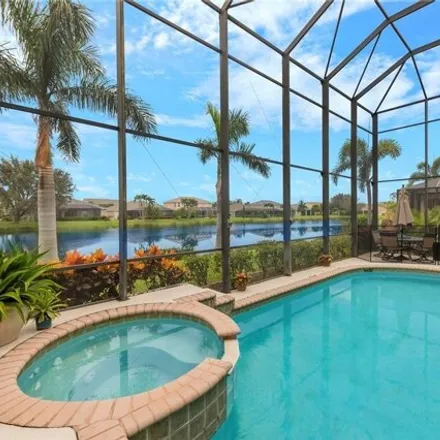 Buy this 5 bed house on 9090 Gladiolus Preserve Circle in Lee County, FL 33908