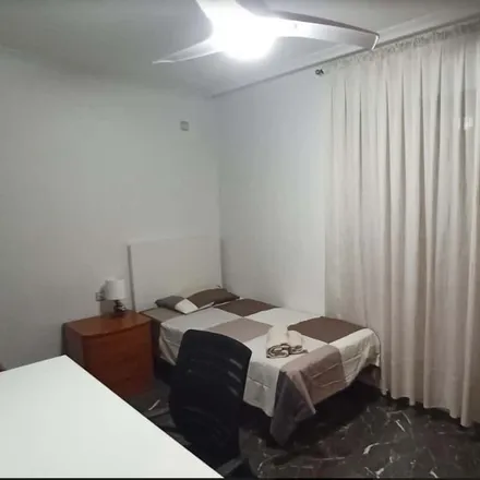 Rent this 4 bed room on Carrer de Fontanars dels Alforins in 24, 46007 Valencia