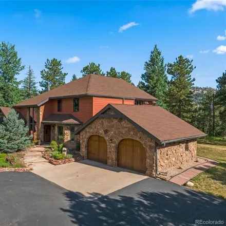 Buy this 4 bed house on 31675 Vista Dr in Evergreen, Colorado