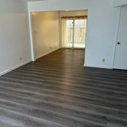 Rent this 2 bed condo on 4840 E University Ave