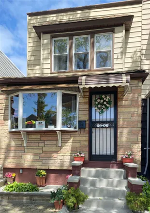 Buy this 3 bed house on 69-09 67th Place in New York, NY 11385