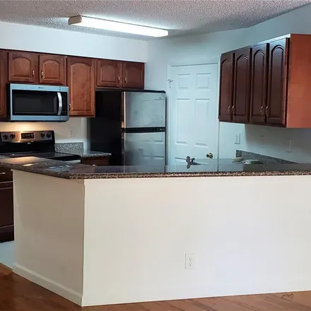 Rent this 2 bed condo on 9999 Summerbreeze Drive