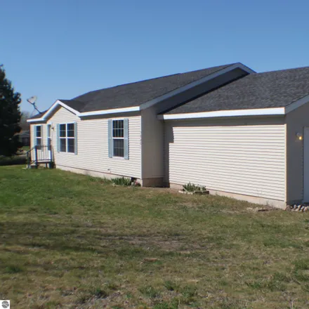 Buy this 3 bed house on 10901 East Timberwoods Drive in Elmwood Charter Township, MI 49684