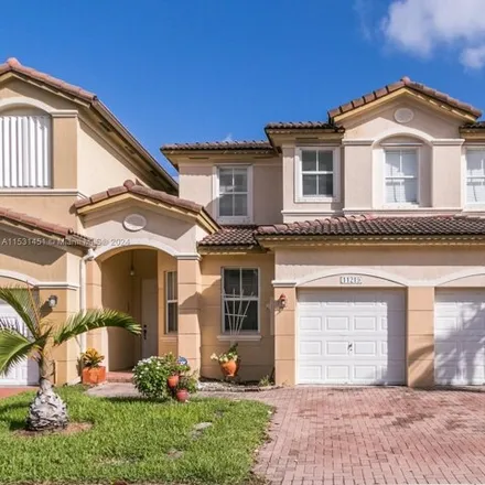 Buy this 4 bed townhouse on 11219 Northwest 74th Terrace in Medley, Miami-Dade County