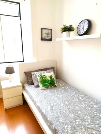 Rent this 4 bed room on Rua António Pereira Carrilho 25 in 1000-047 Lisbon, Portugal