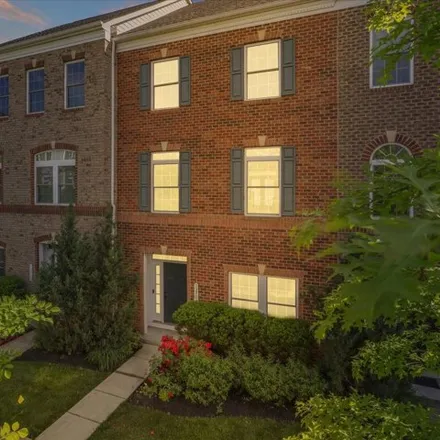 Buy this 4 bed townhouse on 13750 Buzz Aldrin Lane in Sully Square, Fairfax County
