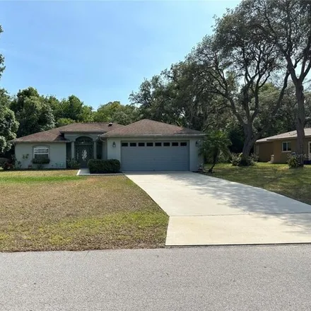 Buy this 3 bed house on 7795 Holiday Drive in Spring Hill, FL 34606