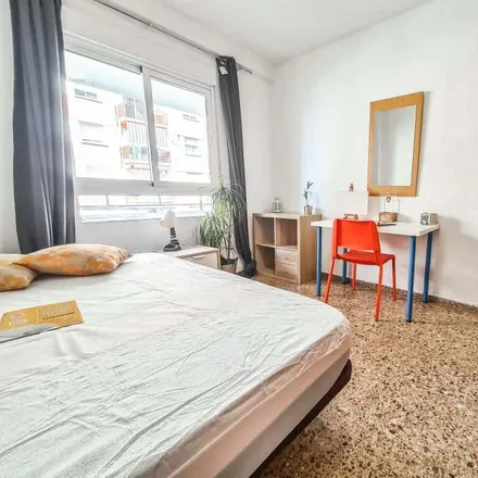 Rent this 4 bed room on Carrer del Mestre Valls in 46022 Valencia, Spain
