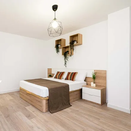 Rent this 7 bed room on Calle de Cartagena in 58, 28028 Madrid