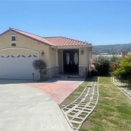 Rent this 4 bed house on 586 Castlehill Street in Walnut, CA 91789