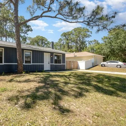 Rent this 3 bed house on 162 Shalimar Avenue Northwest in Palm Bay, FL 32907